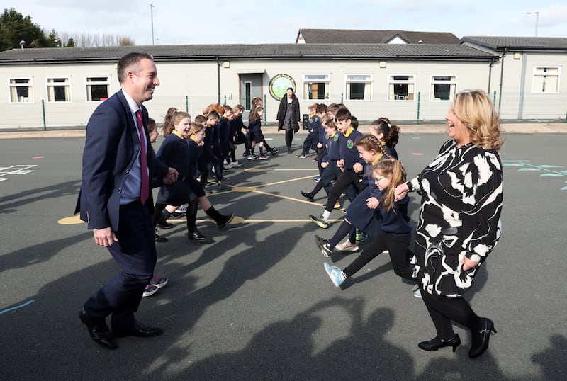 Education Minister Paul Givan takes part in a Ceili, with pupils at Gaelscoil Aodha Rua during his first visit to an Irish language school as Minister.
PICTURE COLM LENAGHAN