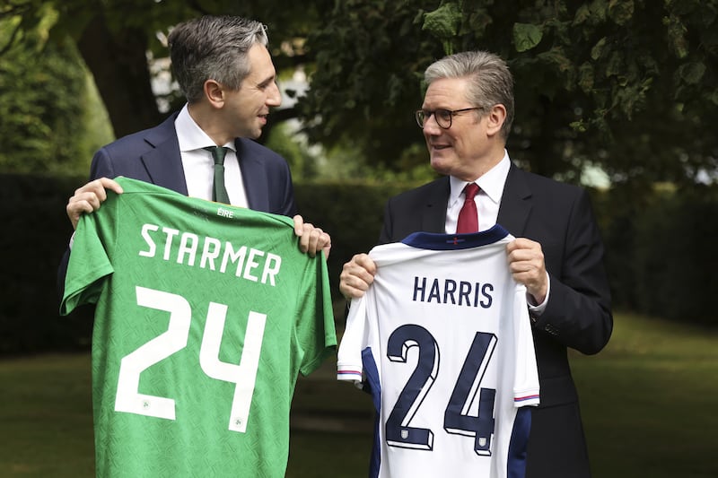 British Prime Minister Sir Keir Starmer and Taoiseach Simon Harris exchange Republic of Ireland and England football shirts