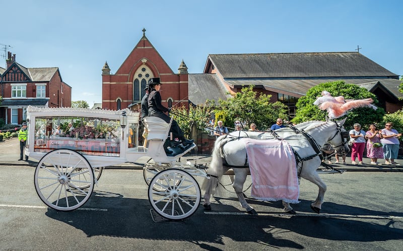 The horse-drawn carriage carrying the coffin of Southport stabbing victim Alice da Silva Aguiar