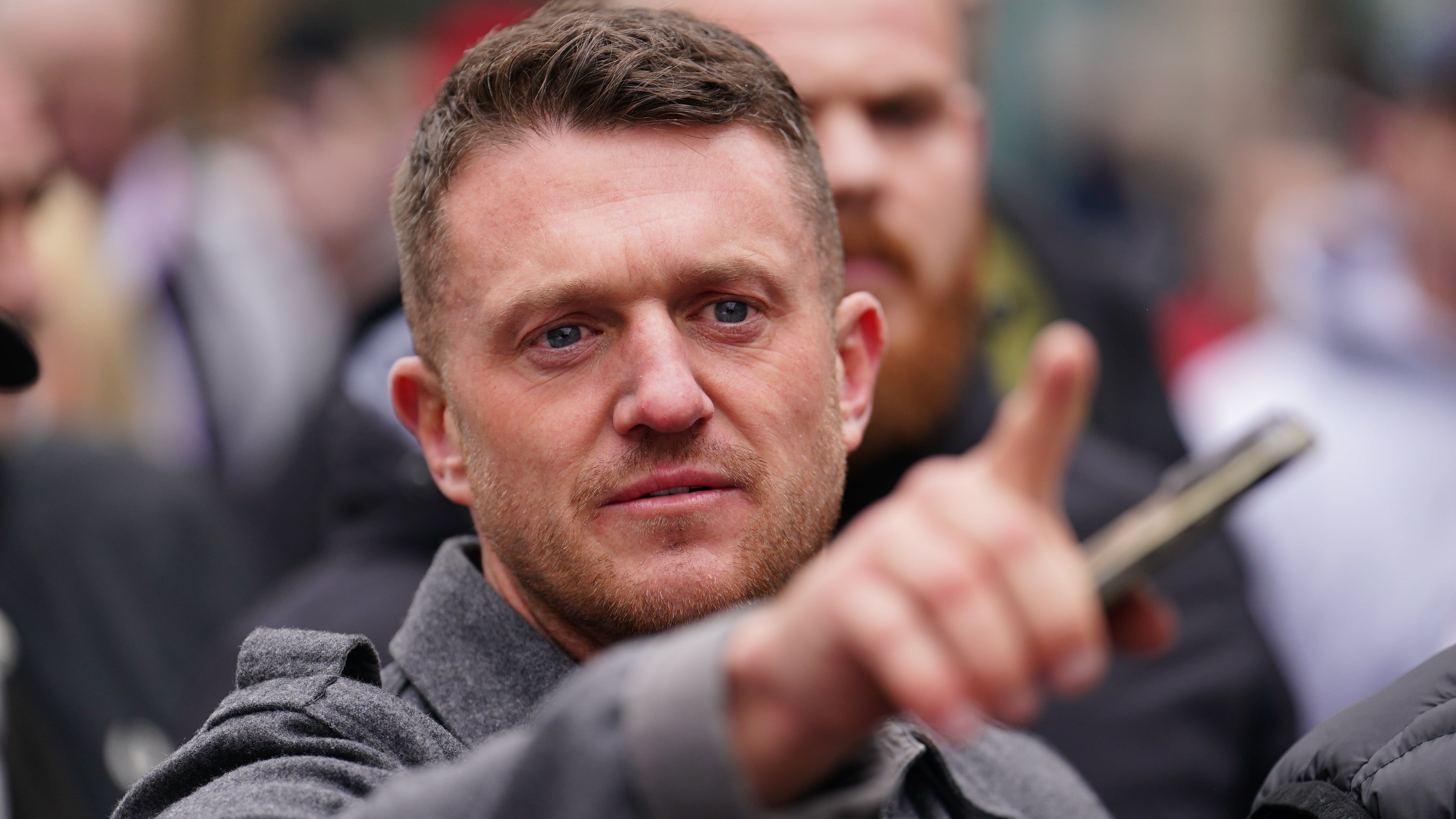 Tommy Robinson said he had been ordered to hand in his passport and told not to leave Canada after being arrested on suspicion of immigration offences