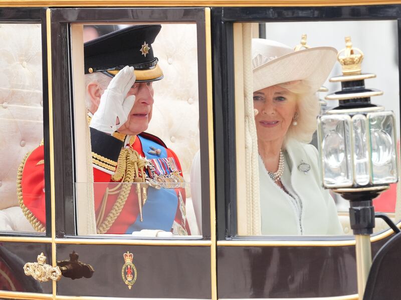 The King and Queen travel along The Mall to the Trooping the Colour ceremony