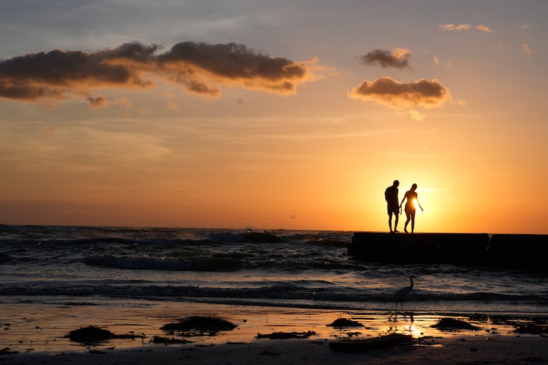 People from Sarasota, Florida visit a beach on Siesta Key (Rebecca Blackwell/AP)