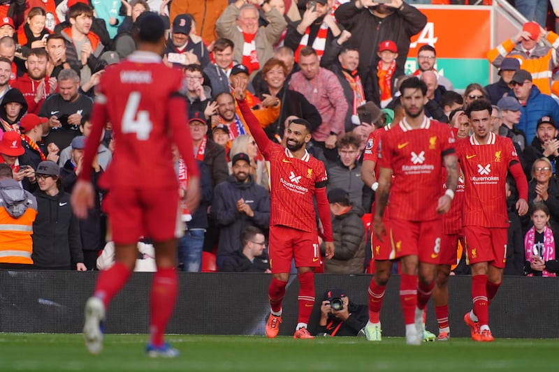 Mohamed Salah (centre) celebrates scoring Liverpool’s opener from the penalty spot