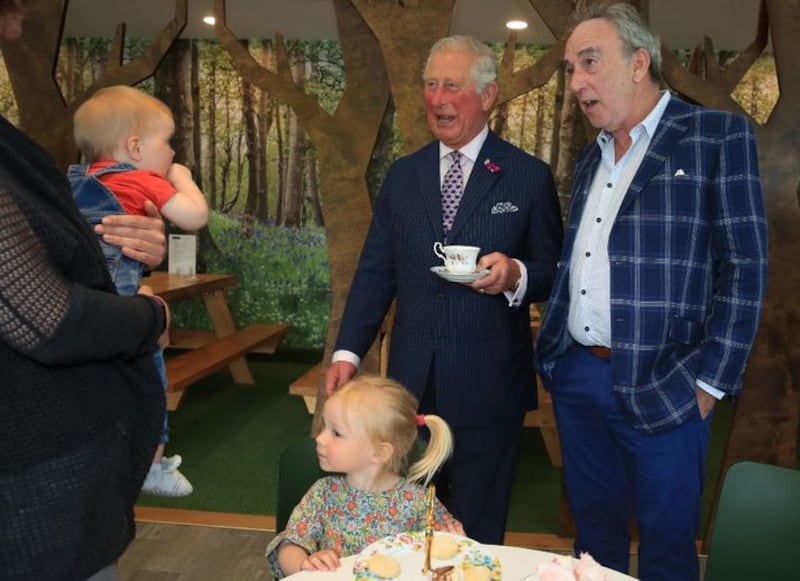 &nbsp;Prince of Wales (centre) meeting Kerry Lynn, holding her 9-month-old daughter Margot Dixon, with Esme Dixon, 2, and Denis Lynn, at the Finnebrogue Artisan event in Downpatrick, Co Down. Tributes have been paid to the prominent Northern Ireland businessman, Denis Lynn, who has died.