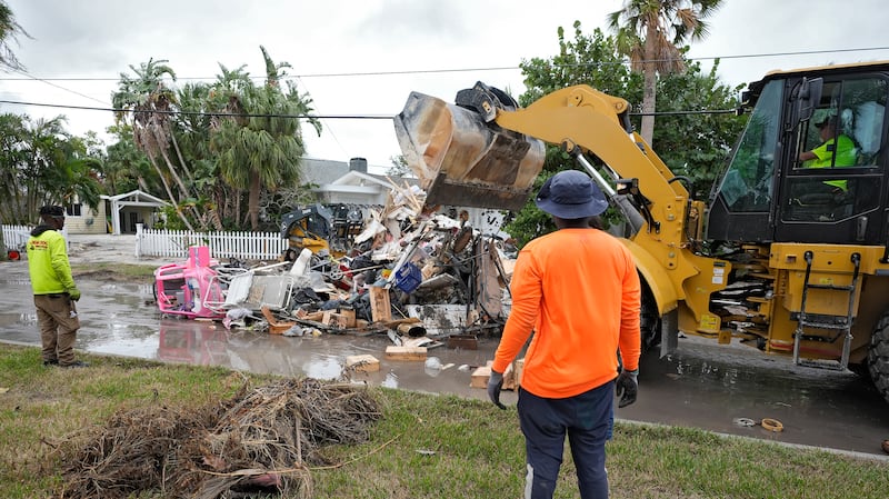 Crews are working to remove the debris before Hurricane Milton approaches Florida’s west coast (Chris O’Meara/AP)