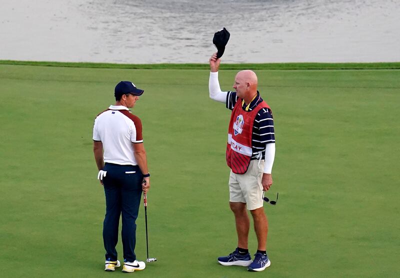 Rory McIlroy argues with Patrick Cantlay’s caddie Joe LaCava on the 18th green during the fourballs on day two of the 44th Ryder Cup