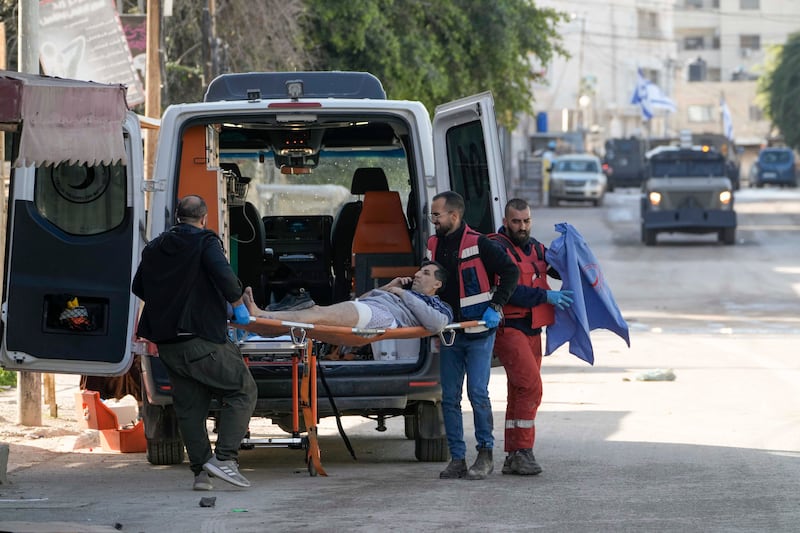 Medics evacuate a wounded man during an Israeli military operation in the West Bank city of Jenin (AP Photo/Majdi Mohammed).