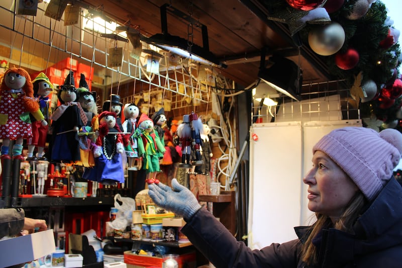 Choosing hand-made mationette puppets at the Old Town Square Christmas market in Prague. (Josie ClarkePA)