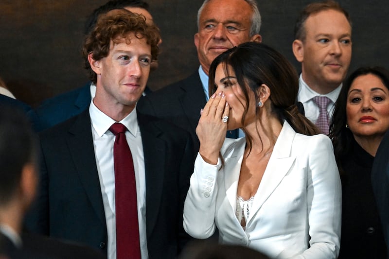 Mark Zuckerberg, left, attended Monday’s inauguration ceremony (Kenny Holston/The New York Times via AP)