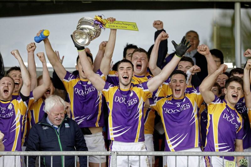 Ryan Jones lifts the trophy for Derrygonnelly. Picture by Donnie Phair. 