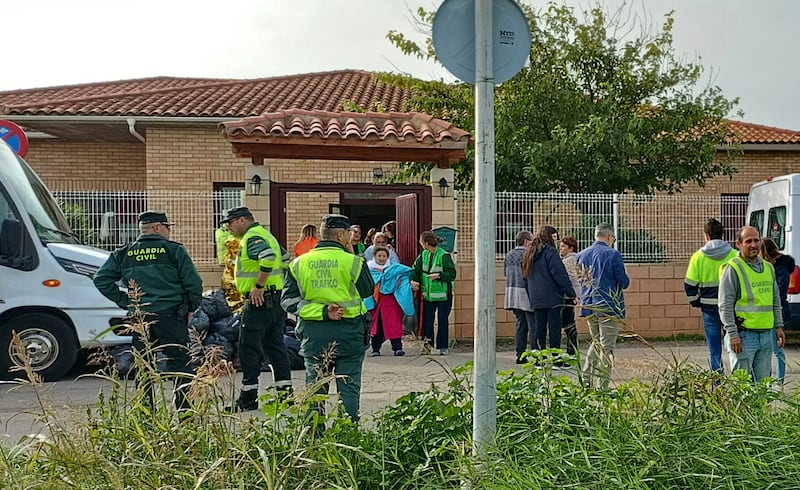 Residents are moved out of the retirement home where at least 10 people have died in a fire in Zaragoza, Spain (Ferran Mallol/AP)