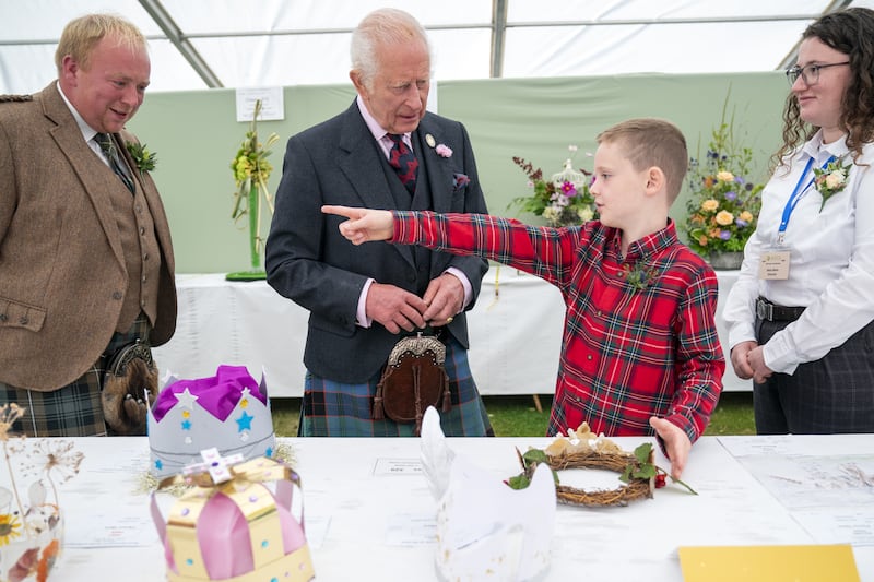 Oliver Keith, eight, from Portlethen, points out his entries to the King