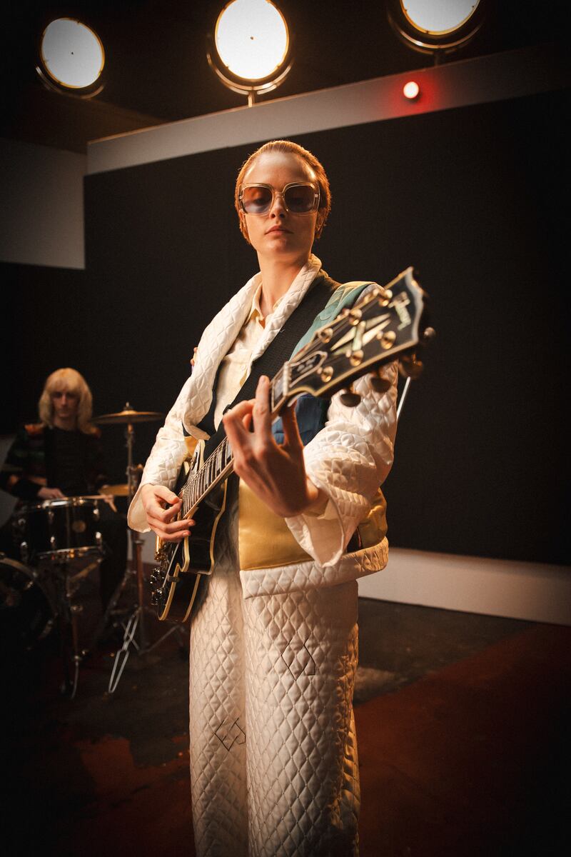 Cara Delevingne stars as Sir Elton John in a new music video for Step Into Christmas. Credit: Thomas Morgan