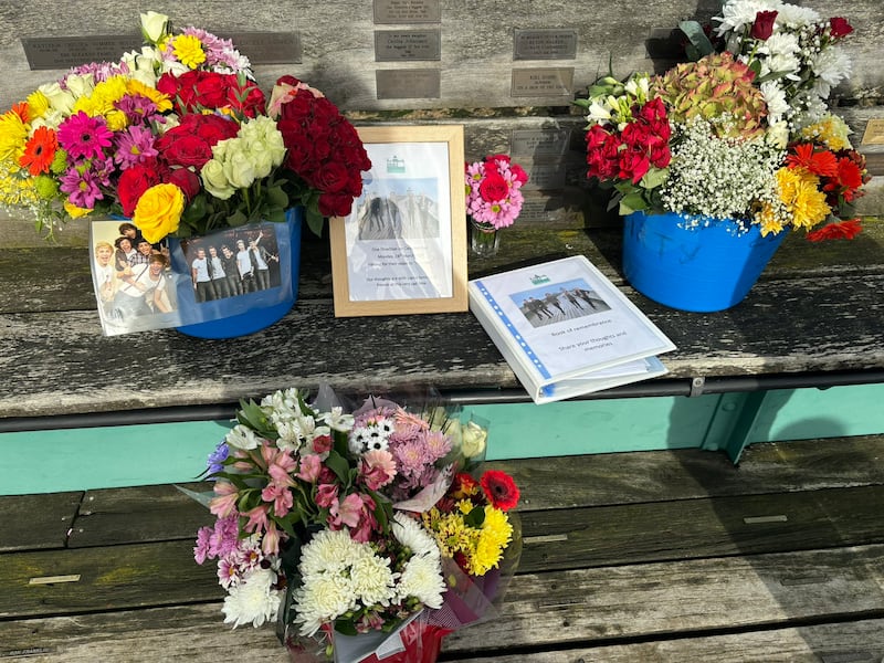 Flowers and cards have been left at a pier in Somerset where One Direction filmed a music video