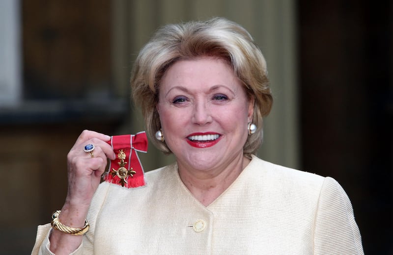 Author Barbara Taylor Bradford poses for pictures after receiving her Most Excellent Order of the British Empire from the Queen at Buckingham Palace in October 2007