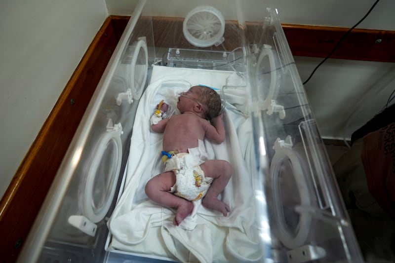 A Palestinian baby boy, not yet named, delivered prematurely after his mother Ola al-Kurd was killed in an Israeli strike,(Abdel Kareem Hana/AP)