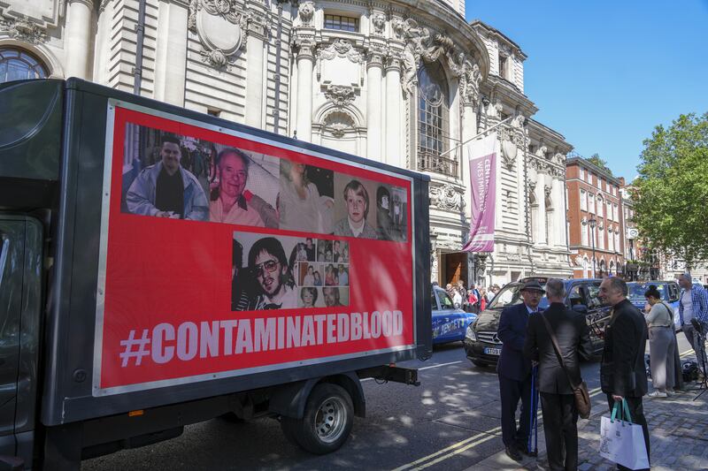 A van with a poster outside Central Hall in Westminster, London, after the publication of the Infected Blood Inquiry report
