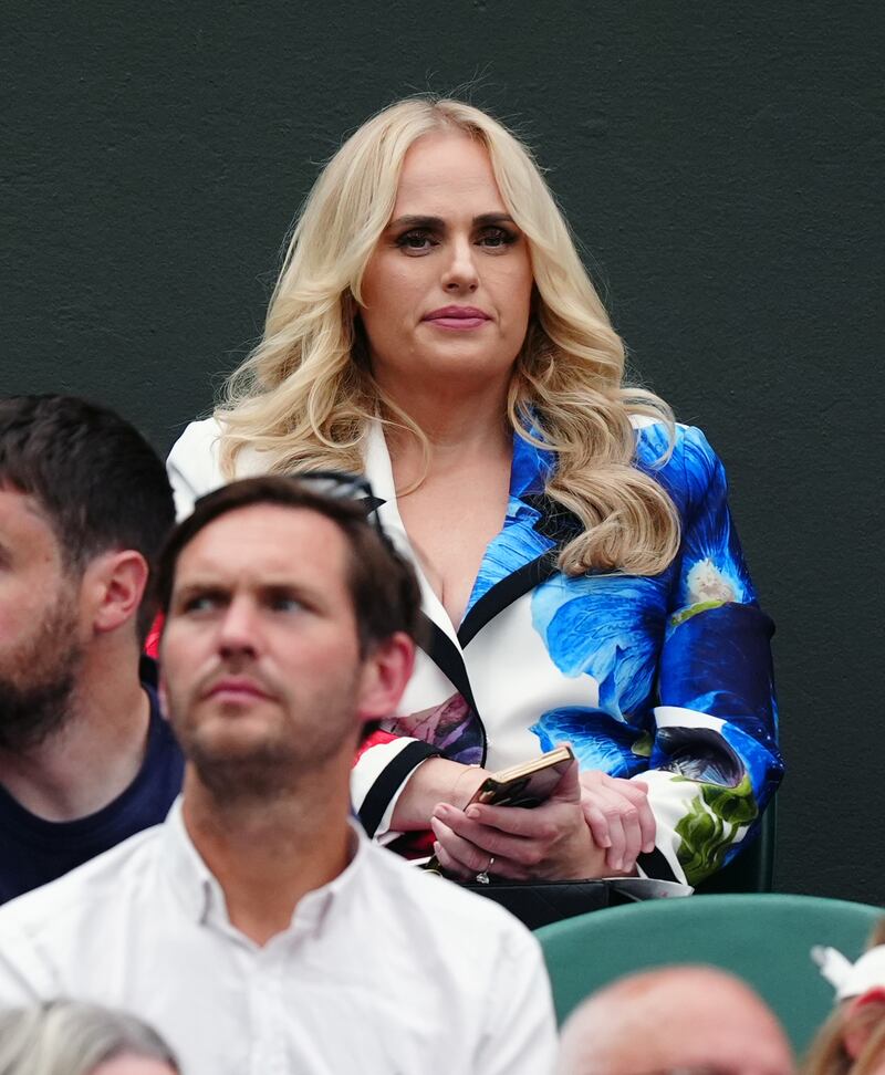 Rebel Wilson watches the centre court action between Novak Djokovic and Vit Kopriva