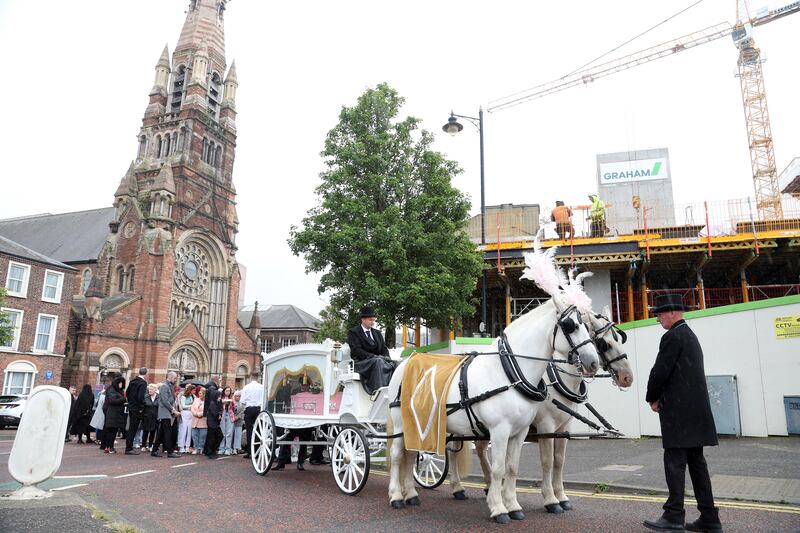 Funeral pink horse and carriage