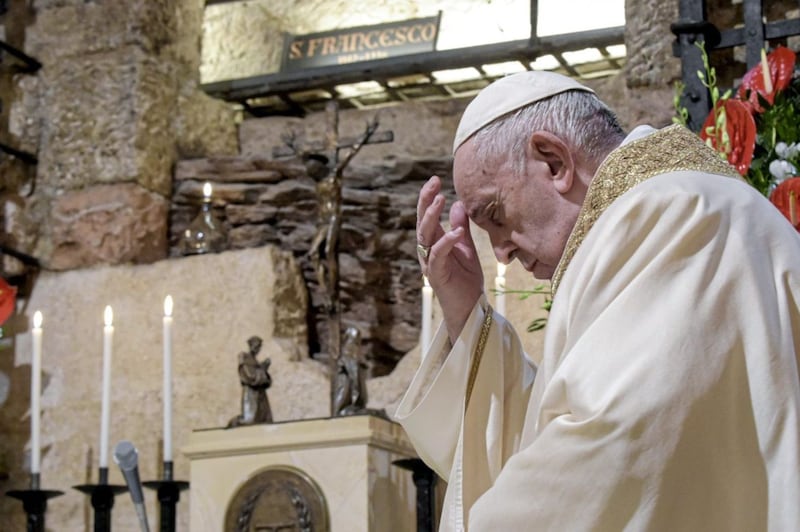 Pope Francis signed Fratelli Tutti on Saturday in Assisi as he celebrated Mass at the tomb of St Francis. Picture by Vatican Media via AP 