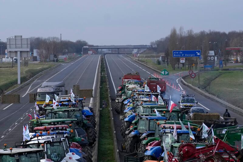 Protesting farmers occupy a motorway in Jossigny, east of Paris (Christophe Ena/AP)