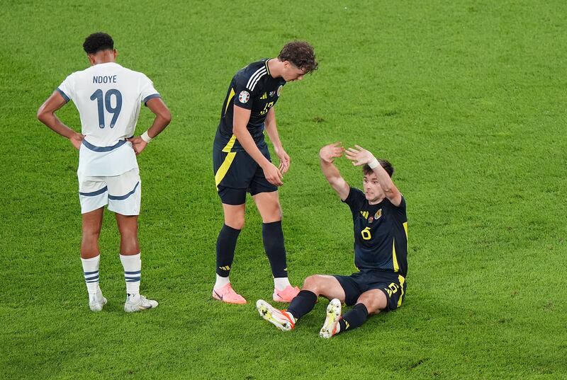 Scotland’s Kieran Tierney (right) suffered an injury against Switzerland .