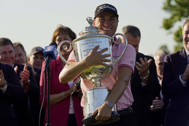 Justin Thomas gives the Wanamaker Trophy a warm embrace after winning last year's US PGA in Tulsa   Picture by AP