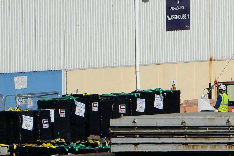 Food aid, left on the pallets, from the US charity World Central Kitchen and the United Arab Emirates is seen being loaded aboard a second vessel preparing to depart for Gaza, at Larnaca port, Cyprus, on Friday (Petros Karadjias/AP)