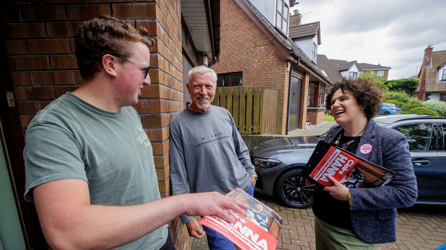 Claire Hanna (right), SDLP Westminster candidate for the constituency of South Belfast and Mid Down in Northern Ireland, speaking with Jimmy Wilkinson and his father Ian, while canvassing in Carryduff