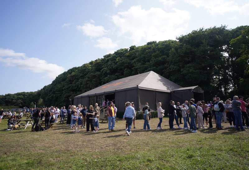 People queuing outside at the opening of Jeremy Clarkson’s new pub, The Farmer’s Dog, in Asthall, near Burford in Oxfordshire in August