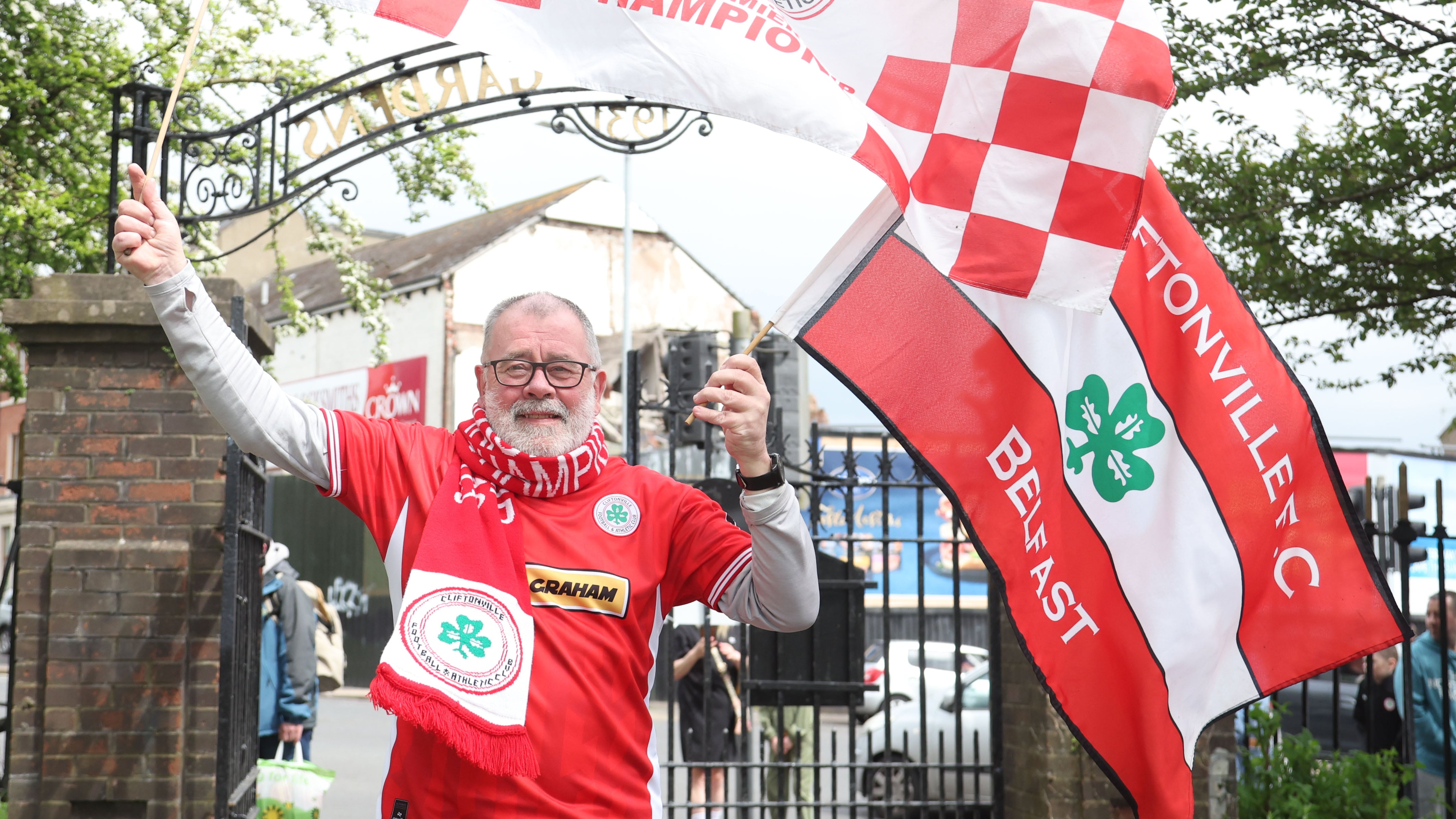 Cliftonville celebrate with the fans during an open top bus tour across Belfast after winning the Irish Cup oat Windsor on Saturday.
PIC COLM LENAGHAN