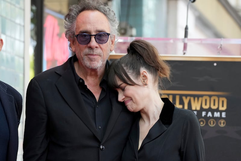 Tim Burton and Winona Ryder at a ceremony honouring Burton with a star on the Hollywood Walk of Fame (Jordan Strauss/Invision/AP)