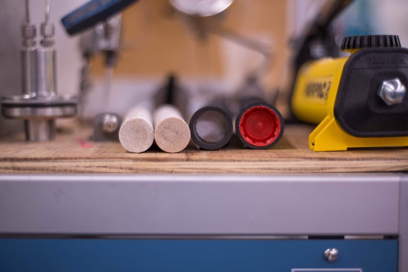 Samples of rock on a workbench, which was used by Rockit to help develop their method of sealing methane-wells.