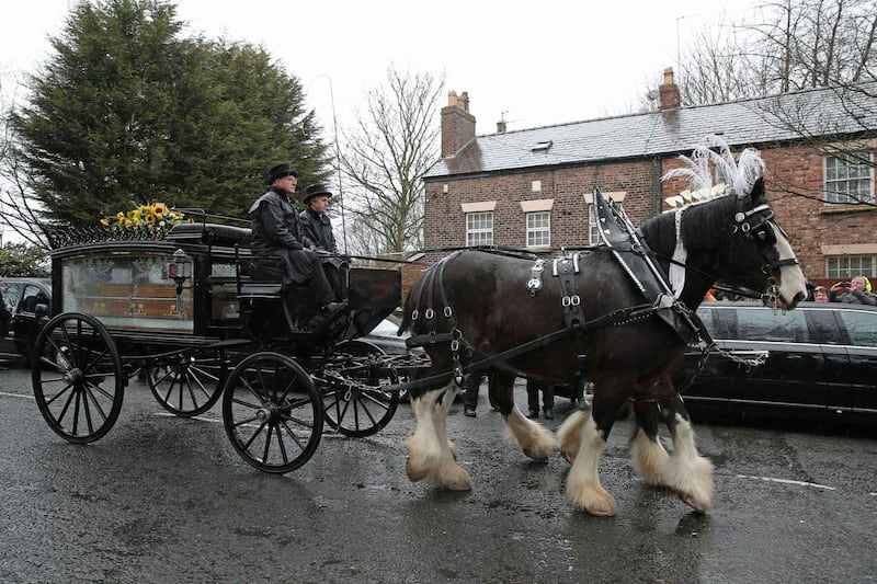 The funeral cortege carries Sir Ken Dodd’s coffin from his home in Knotty Ash (Aaron Chown/PA)