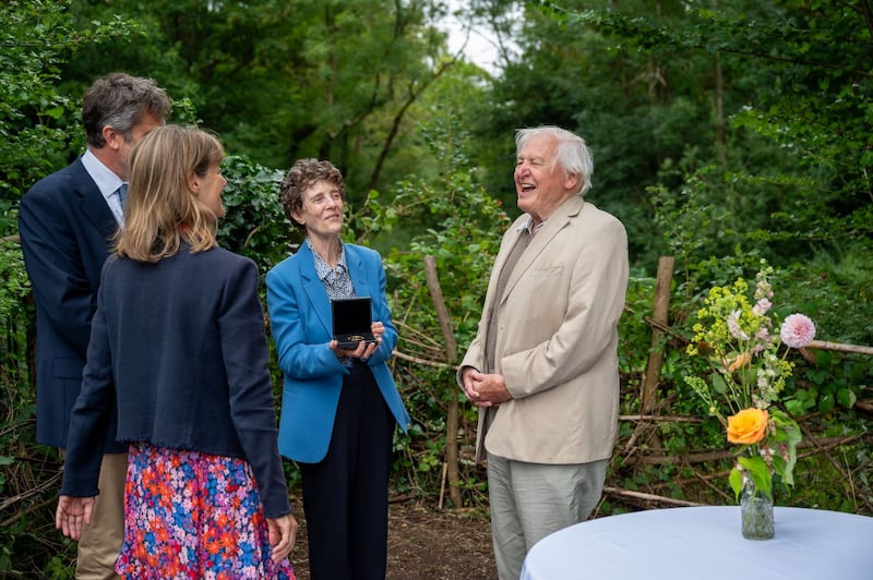 Charlotte Lane presents Sir David Attenborough with the medal. (Broni Lloyd-Edwards/Wildlife Trusts)