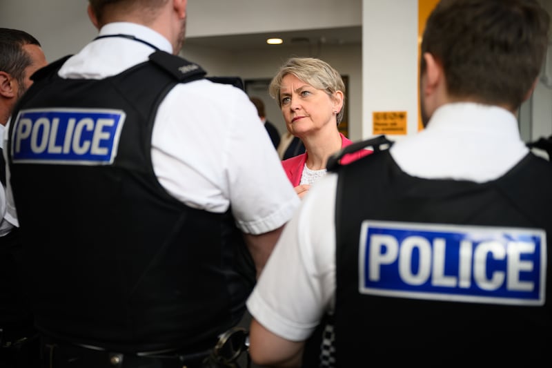 Home Secretary Yvette Cooper speaks to police officers