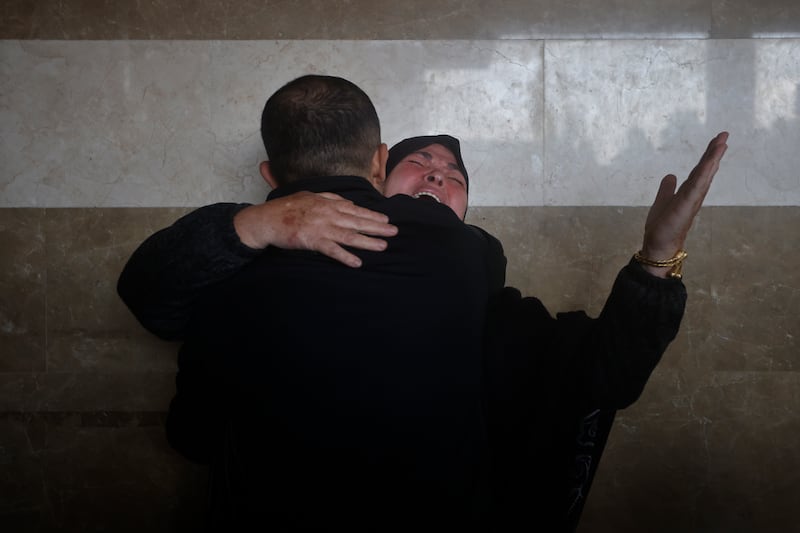 A Palestinian woman cries for her relatives who were killed in the Israeli bombardment of the Gaza Strip, at Nasser hospital in Khan Younis (Mohammed Dahman/AP)