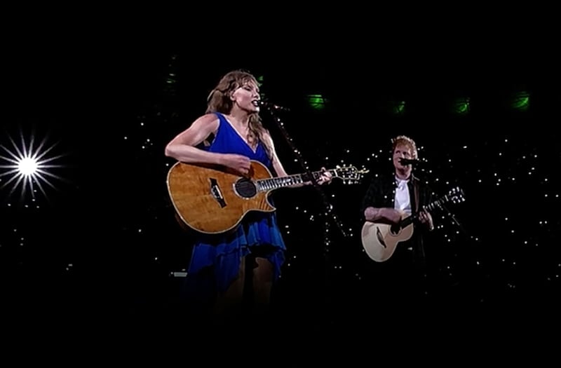 Taylor Swift performs on stage with surprise guest, Ed Sheeran