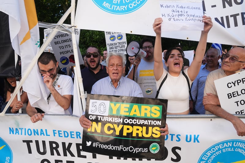 The protesters gathered outside the Turkish embassy in central London