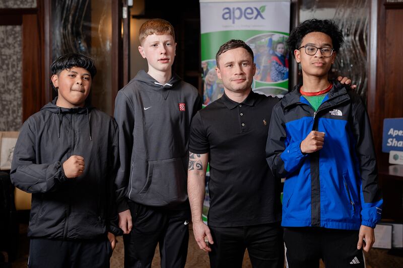 Two-time world champion boxer Carl Frampton, pictured with Jerdy Cardoso Soares, Ethan Wilkinson and Rusmaldino Cista Da Cruz from Dungannon who took part in the Fight2Thrive boxing programme, supported by Apex Housing Association.