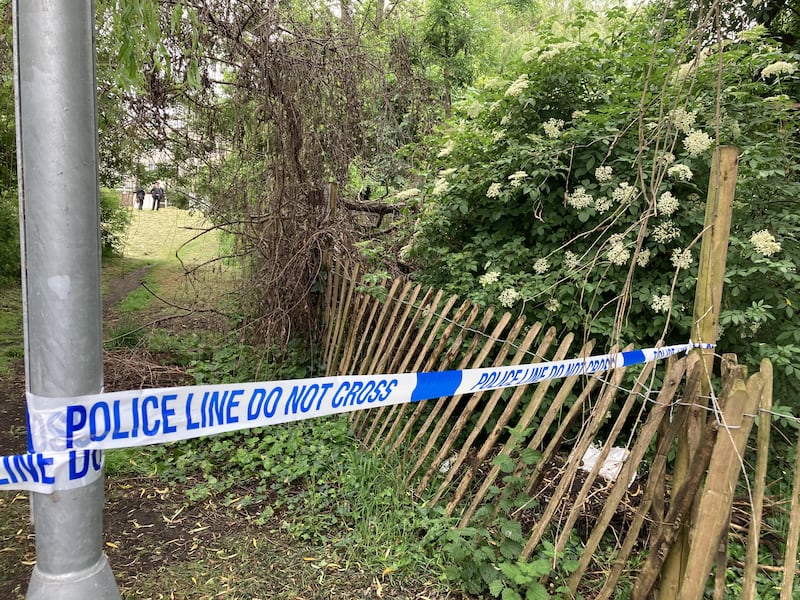 Police tape cordons off the area near where the body was found