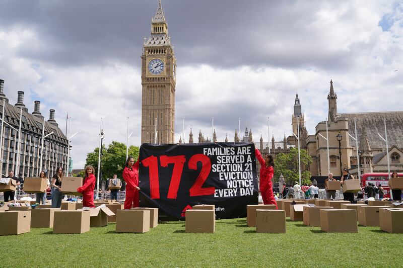 Activists from Shelter protest no-fault evictions in Parliament Square in 2023