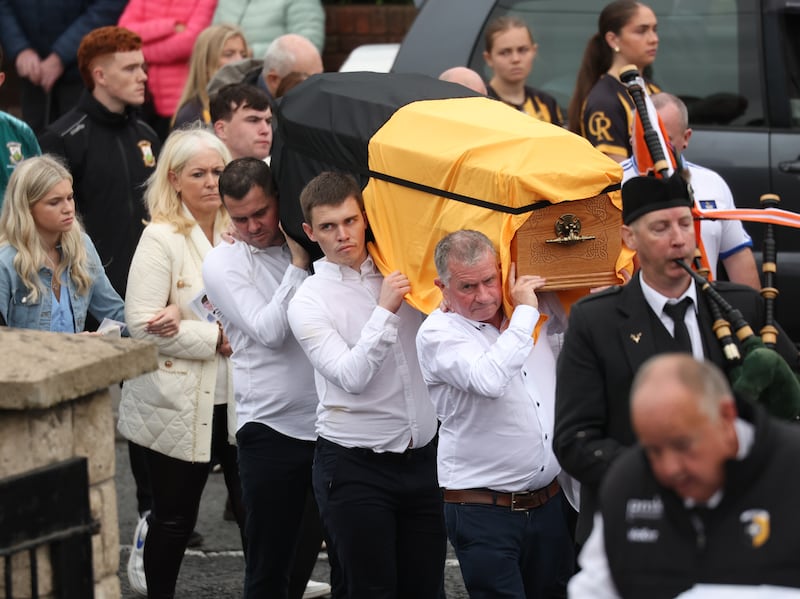 Family and Friends  carry the coffin of Crossmaglen Rangers player Caolan Finnegan during his funeral on Monday, Caolan received a lap of honour at Crossmaglen ground before the funeral at St Patrick’s Church.
PICTURE COLM LENAGHAN