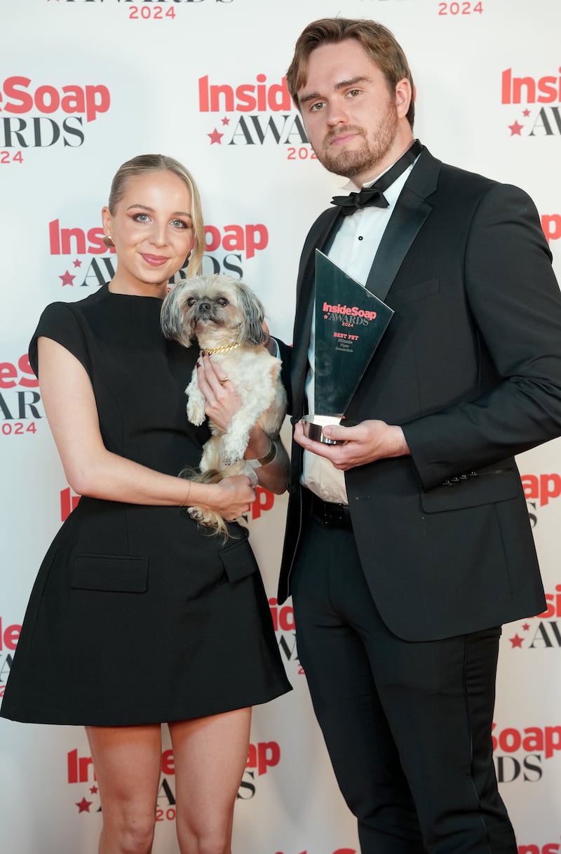 Eden Taylor-Draper with Minnie the dog and James Chase with the Best Pet Award at the Inside Soap Awards