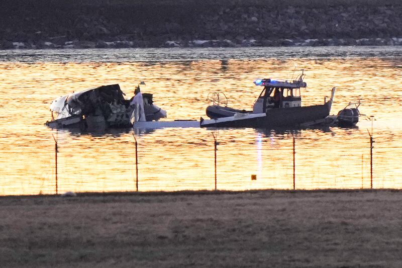 Search and rescue efforts (Mark Schiefelbein/AP)