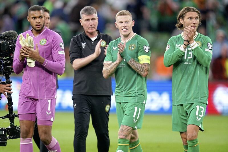 Republic of Ireland goalkeeper Gavin Bazunu (left), manager Stephen Kenny, centurion James McClean and Jeff Hendrick celebrate their 3-0 victory over Gibraltar in Dublin 