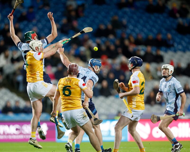 Antrim's Paddy Burke bats the ball away as he and team mates Eoghan Campbell (6) and Keelan Molloy battle with Dublin's John Hetheron and Darragh Power at Croke Park Picture: Dylan McIlwaine