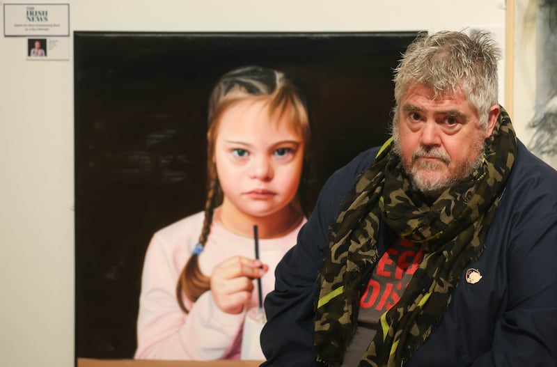 Phill Jupitus pictured beside a painting at an exhibition at The Ulster Museum in Belfast.
PICTURE COLM LENAGHAN