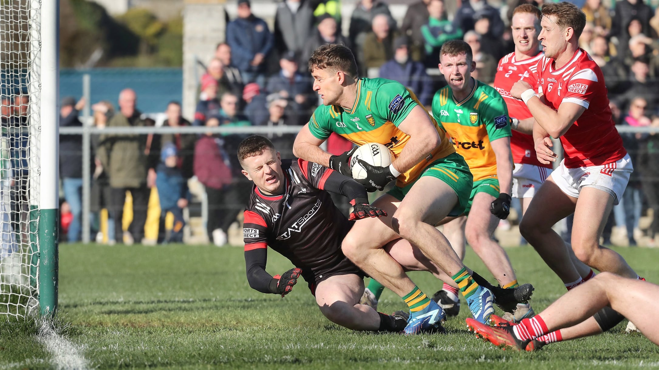 Donegal Hugh McFadden is challenged by Louth keeper Niall McDonnell close to the net where a goal was scored in the scramble during the National Football League match played at Fr Tierney Park in Ballyshannon on Sunday 3rd March 2024. Picture Margaret McLaughlin