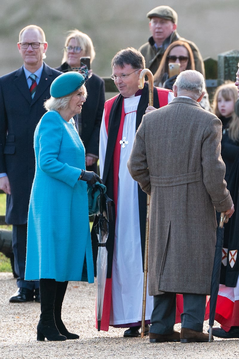 The Bishop of Norwich, Right Reverend Graham Usher greets the King and Queen at St Mary Magdalene Church in Sandringham, Norfolk